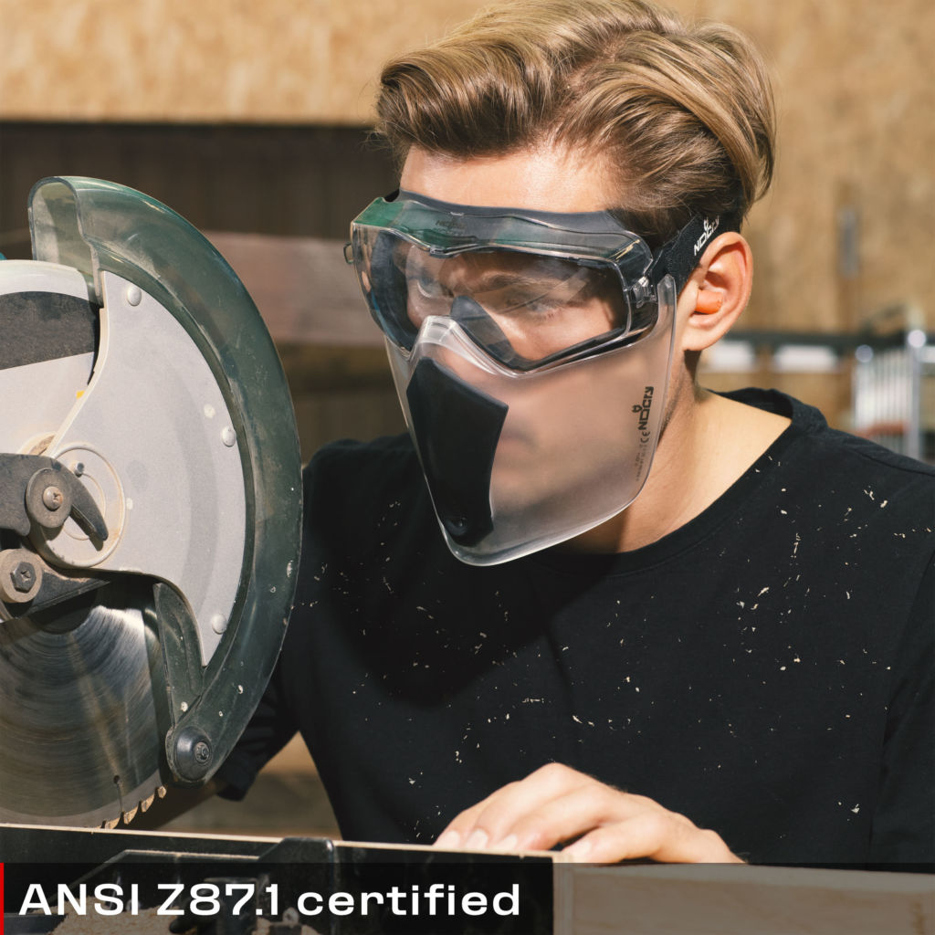 Man using safety goggles attached to face shield